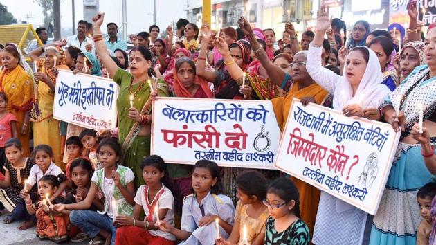 Congress activists and children take part in a protest against the alleged gang rape of a student in Bhopal. (PTI Photo) Congress activists and children take part in a protest against the alleged gang rape of a student in Bhopal. (PTI Photo)