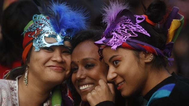 Three participants pose during the 2013 Delhi Queer Pride march. The parade is a yearly festival, held on the last Sunday of November, to honour and celebrate lesbian, gay, bisexual, transgender, intersex and many gender and sexual non-conforming people, and their supporters. (Sanjeev Verma / HT Photo) 