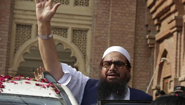 Hafiz Saeed waves on his arrival to a court in Lahore, Pakistan on October 19. (AP File Photo) Hafiz Saeed waves on his arrival to a court in Lahore, Pakistan on October 19. (AP File Photo)