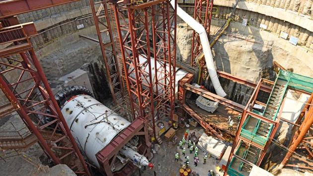 Workers assemble the left TBM and begin tunneling work with the right one at Naya Nagar in Mahim on Friday.(Satyabrata Tripathy/HT)