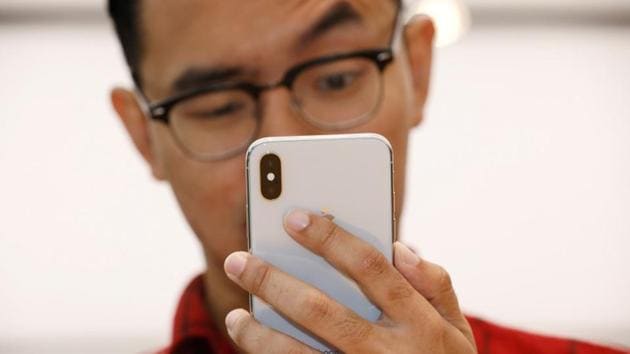 A man tries out the Animoji feature on an iPhone X during its launch at the Apple store in Singapore November 3, 2017. (REUTERS) A man tries out the Animoji feature on an iPhone X during its launch at the Apple store in Singapore November 3, 2017. (REUTERS)