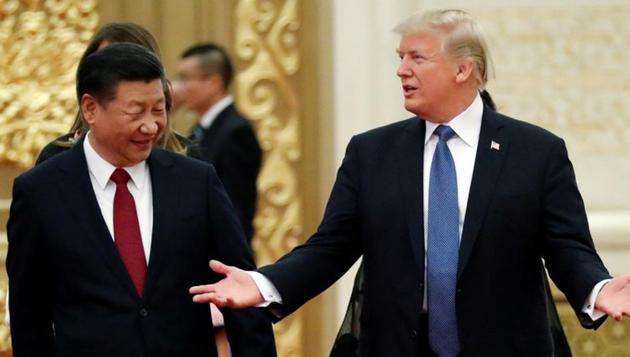 US President Donald Trump and China's President Xi Jinping arrive for a state dinner at the Great Hall of the People in Beijing, China, November 9, 2017. (REUTERS) US President Donald Trump and China's President Xi Jinping arrive for a state dinner at the Great Hall of the People in Beijing, China, November 9, 2017. (REUTERS)