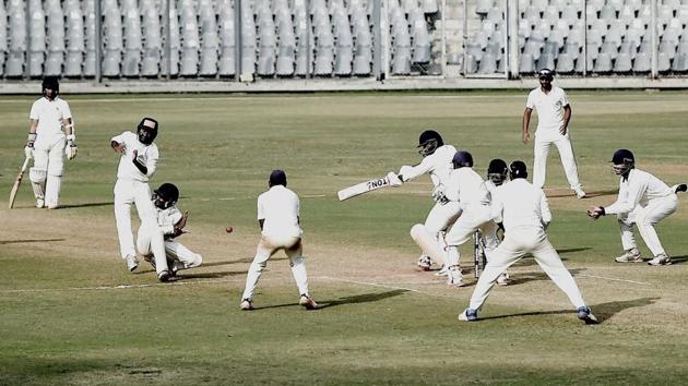 Baroda fielders close in near Mumbai's Dhawal Kulkarni during the final day of the Ranji Trophy match at Wankhede stadium in Mumbai on Sunday. (PTI) Baroda fielders close in near Mumbai's Dhawal Kulkarni during the final day of the Ranji Trophy match at Wankhede stadium in Mumbai on Sunday. (PTI)