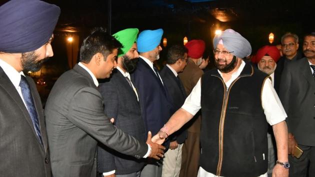 Chief minister Captain Amarinder Singh interacting with police officials at a dinner hosted by him at his residence on Saturday night. (HT Photo) Chief minister Captain Amarinder Singh interacting with police officials at a dinner hosted by him at his residence on Saturday night. (HT Photo)