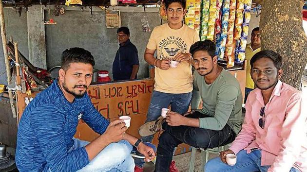 B.Sc student Khilraj Rathwa (far right) credits Prime Minister Narendra Modi for constructing roads and ensuring electricity for 24 hours. (HT Photo) B.Sc student Khilraj Rathwa (far right) credits Prime Minister Narendra Modi for constructing roads and ensuring electricity for 24 hours. (HT Photo)
