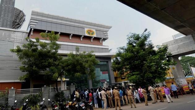 Media personnel stand guard in front of the “Jaya TV” where IT officials conducted a raid, in Chennai on Nov 9.(PTI Photo)
