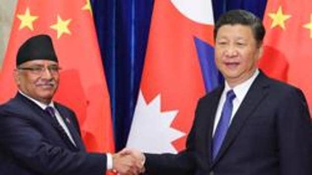 Chinese President Xi Jinping (right) shakes hands with former Nepal prime minister Pushpa Kamal Dahal at the Great Hall of the People in Beijing on March 27, 2017. (AFP) Chinese President Xi Jinping (right) shakes hands with former Nepal prime minister Pushpa Kamal Dahal at the Great Hall of the People in Beijing on March 27, 2017. (AFP)