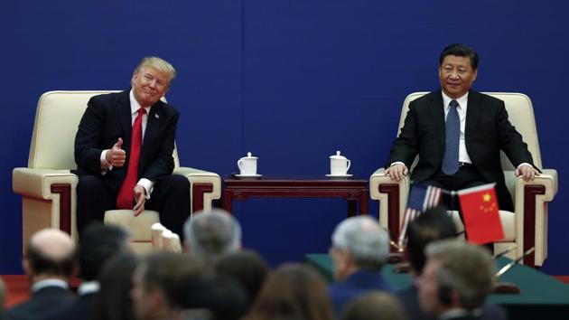 US President Donald Trump and Chinese President Xi Jinping during a business event, Great Hall of the People, Beijing, November 9(AP)