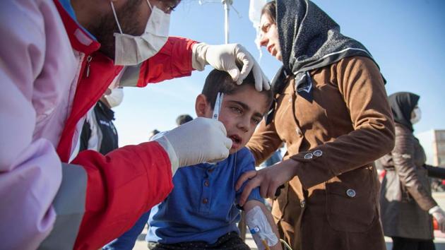 A wounded boy is treated by members of the Red Crescent following a quake in Sarpol-e Zahab, which reorded the highest casualties in Kermanshah, Iran. The Students News agency ISNA quoted the coroner’s office in the province as saying that the death toll was expected to increase. (Tasnim News Agency / REUTERS) A wounded boy is treated by members of the Red Crescent following a quake in Sarpol-e Zahab, which reorded the highest casualties in Kermanshah, Iran. The Students News agency ISNA quoted the coroner’s office in the province as saying that the death toll was expected to increase. (Tasnim News Agency / REUTERS)