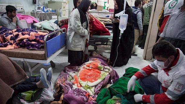 People receive treatment following an earthquake in Sarpol-e Zahab county in Kermanshah, Iran November 13, 2017. The main hospital of the capital of the county was severely damaged and could not treat hundreds of injured people who were taken there, the head of the Iranian emergency services, Pirhossein Koulivand said. (Tasnim News Agency / Handout via REUTERS ) People receive treatment following an earthquake in Sarpol-e Zahab county in Kermanshah, Iran November 13, 2017. The main hospital of the capital of the county was severely damaged and could not treat hundreds of injured people who were taken there, the head of the Iranian emergency services, Pirhossein Koulivand said. (Tasnim News Agency / Handout via REUTERS )