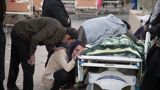 A woman reacts next to a dead body following an earthquake in Sarpol-e Zahab in Kermanshah, Iran. The 7.3-magnitude quake was centered 31 kms outside the eastern Iraqi city of Halabja yesterday, according to measurements from the US Geological Survey. Its impact was felt as far west as the Mediterranean coast with worst damage appearing to be in Iran’s western Kermanshah province, which sits in the Zagros Mountains dividing Iran and Iraq. (Tasnim News Agency / Handout via REUTERS ) A woman reacts next to a dead body following an earthquake in Sarpol-e Zahab in Kermanshah, Iran. The 7.3-magnitude quake was centered 31 kms outside the eastern Iraqi city of Halabja yesterday, according to measurements from the US Geological Survey. Its impact was felt as far west as the Mediterranean coast with worst damage appearing to be in Iran’s western Kermanshah province, which sits in the Zagros Mountains dividing Iran and Iraq. (Tasnim News Agency / Handout via REUTERS )