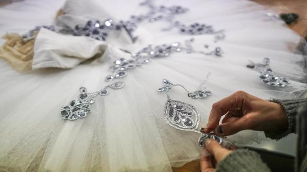 A seamstress sews a tutu in Montevideo, Uruguay. (AP File Photo) A seamstress sews a tutu in Montevideo, Uruguay. (AP File Photo)