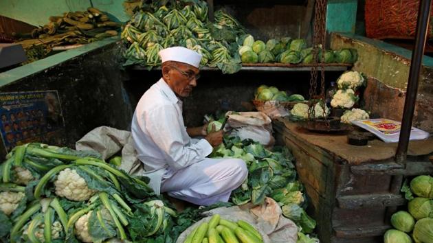 A vendor works at his stall as he waits for customers at a wholesale fruit and vegetable market in Mumbai, India, August 14, 2017. (Reuters File Photo) A vendor works at his stall as he waits for customers at a wholesale fruit and vegetable market in Mumbai, India, August 14, 2017. (Reuters File Photo)