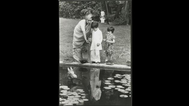 Indira Gandhi with her grandchildren Rahul (L) and Priyanka (R), circa 1975, photographed by Paul Saltzman. She was very fond of the kids and this photograph was taken by the lotus pond, in the garden of her official residence 1, Safdarjung Road, which is now the Indira Gandhi Memorial. (Courtesy Indira Gandhi Memorial Trust Archive) Indira Gandhi with her grandchildren Rahul (L) and Priyanka (R), circa 1975, photographed by Paul Saltzman. She was very fond of the kids and this photograph was taken by the lotus pond, in the garden of her official residence 1, Safdarjung Road, which is now the Indira Gandhi Memorial. (Courtesy Indira Gandhi Memorial Trust Archive)