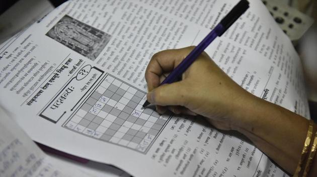 Jayalaxmi solves the crossword puzzle in the Sanskrit language daily Sudharma, in Mysuru, Karnataka. Jayalaxmi and her husband Sampath Kumar run Sudharma, India’s oldest surviving Sanskrit newspaper which was started by her father-in-law Varadaraja Iyenger in 1970. (Arijit Sen / HT Photo)