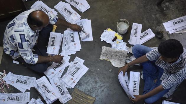 Workers fold the two-page daily at the press in Mysuru. In this age of high-blitz marketing and visibility, Sudharma –with its nearly 4,000 subscribers-- has stuck to its roots. The newspaper has no marketing team, let alone a marketing budget. (Arijit Sen / HT Photo)