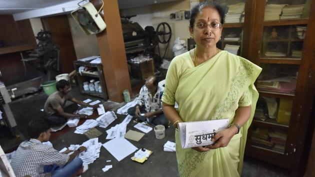 Jayalaxmi, the proprietor of Sudharma at the newspaper’s press. “If a worker falls ill, I take his place to fold the paper and stick the postage stamp on it. It’s a printing press started by a scholar, and a paper run by scholars too,” she says. (Arijit Sen / HT Photo)