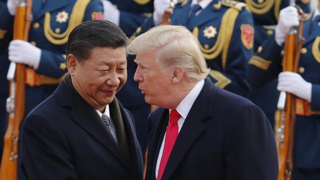 In this November 9, 2017 file photo, US President Donald Trump, right, chats with Chinese President Xi Jinping during a welcome ceremony at the Great Hall of the People in Beijing. (AP File Photo) In this November 9, 2017 file photo, US President Donald Trump, right, chats with Chinese President Xi Jinping during a welcome ceremony at the Great Hall of the People in Beijing. (AP File Photo)