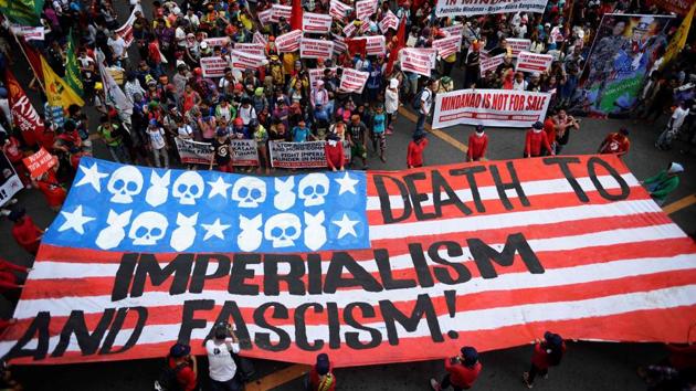 Protesters march towards the Malacanang Palace during a demonstration against US President Trump attending the ASEAN Summit in Manila. Rights groups had called on Trump to speak out over Duterte’s drug war but the former has so far shown only warmth for a strongman leader who has boasted of personally killing people if the need arises. (Noel Celis / AFP)