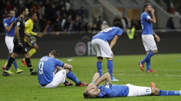 Italy's Ciro Immobile, foreground, and Italy's Andrea Belotti, seated left, react after the match, (AP) Italy's Ciro Immobile, foreground, and Italy's Andrea Belotti, seated left, react after the match, (AP)