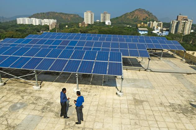 Solar Panels put up on the terrace of a building at the IIT Bombay campus in Mumbai. Union minister Dharmendra Pradhan said at a conference at the institute recently that there was no alternative to affordable, accessible, clean, sustainable energy, and that the government was committed to extend all kinds of cooperation to Indian institutions and researchers.(Abhijit Bhatlekar/ Mint)