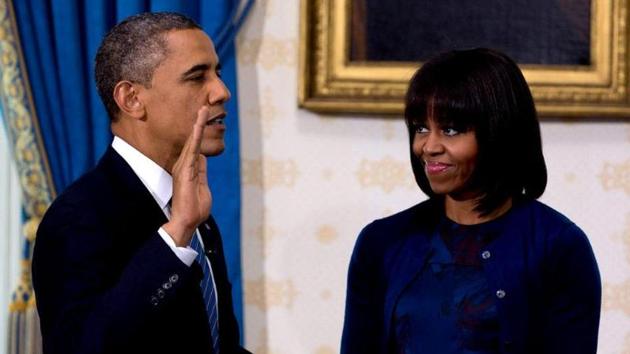 Barack Obama taking the oath of office at the official swearing-in ceremony in the White House in Washington. Holding the Bible is First Lady Michelle Obama (AFP File Photo)