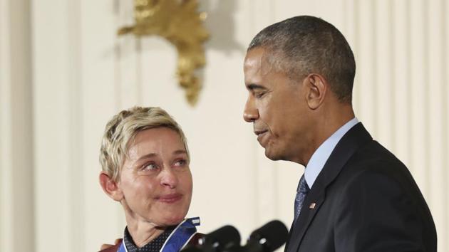 Comedian and talk show host Ellen DeGeneres glances at President Barack Obama as she is presented the Presidential Medal of Freedom during a ceremony in the East Room of the White House in Washington. DeGeneres made history 20 years ago as the first prime-time lead on network TV to come out, capturing the hearts of supporters LGBTQ rights. (AP File Photo)
