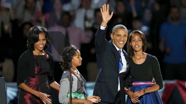 Barack Obama with former first lady Michelle Obama and their daughters Sasha and Malia on election night at Chicago, Illinois. (AFP File Photo)