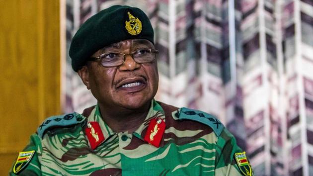 General Constantino Chiwenga, Commander of the Zimbabwe Defence Forces addresses the media on November 13, 2017. Zimbabwe’s ruling party ZANU-PF on Tuesday responded to Chiwenga challenging President Mugabe over the sacking of the vice president in a statement that said criticism was “clearly calculated to disturb national peace... and suggests treasonable conduct on his part as this was meant to incite insurrection.” (Jekesai Njikizana / AFP) 