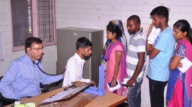 A doctor examines a patient at a government hospital in Rishikesh. (HT File) A doctor examines a patient at a government hospital in Rishikesh. (HT File)