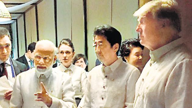 Prime Minister Narendra Modi with Japanese Prime Shinzo Abe and US President Donald Trump, at an ASEAN Summit dinner, Manila, November 12(PTI)