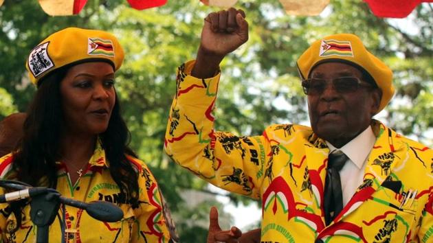 President Mugabe and his wife Grace attend a rally of his ruling ZANU-PF party on November 8, 2017. Mugabe last week fired vice-president Emmerson Mnangagwa accusing him of plotting to take power, including through witchcraft. Earlier this year the country was gripped by a bizarre spat between Grace and Mnangagwa that included an alleged ice-cream poisoning incident. (Philimon Bulawayo / REUTERS) 