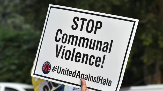 An activist displays a placard during a protest demanding justice for Umar Khan, who was killed while transporting cows, at Bikaner House in New Delhi on Wednesday.(PTI) An activist displays a placard during a protest demanding justice for Umar Khan, who was killed while transporting cows, at Bikaner House in New Delhi on Wednesday.(PTI)