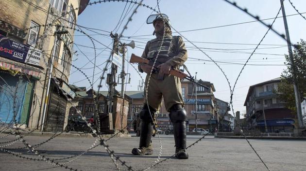 A jawan stands guard in Srinagar during restrictions in many parts of the Kashmir Valley. (PTI file photo) A jawan stands guard in Srinagar during restrictions in many parts of the Kashmir Valley. (PTI file photo)