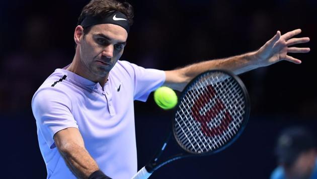 Switzerland's Roger Federer returns against Germany's Alexander Zverev during their ATP Finals tennis tournament. (AFP) Switzerland's Roger Federer returns against Germany's Alexander Zverev during their ATP Finals tennis tournament. (AFP)