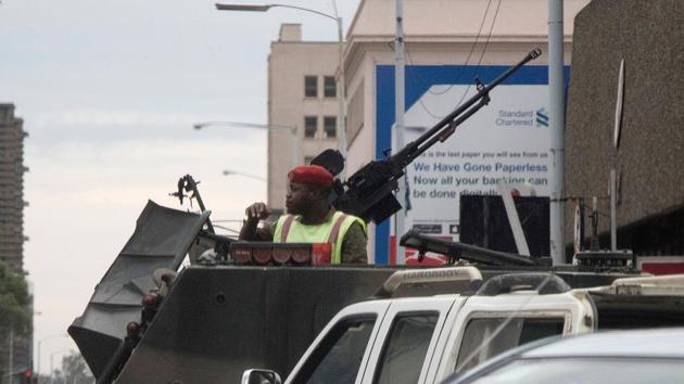 Zimbabwean soldiers stand by an intersection as they regulate civilian traffic in Harare on November 15, 2017. Zimbabwe's military appeared to be in control of the country as generals denied staging a coup but used state television to vow to target "criminals" close to President Robert Mugabe. (AFP) Zimbabwean soldiers stand by an intersection as they regulate civilian traffic in Harare on November 15, 2017. Zimbabwe's military appeared to be in control of the country as generals denied staging a coup but used state television to vow to target "criminals" close to President Robert Mugabe. (AFP)