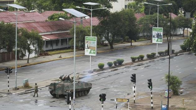 A military tank is seen with armed soldiers on the road leading to President Mugabe’s office in Harare. The military has detained finance minister Ignatius Chombo after seizing power in an attempt to root out “criminals” around President Mugabe who it said were causing social and economic suffering, a government source said. (Tsvangirayi Mukwazhi / AP) 
