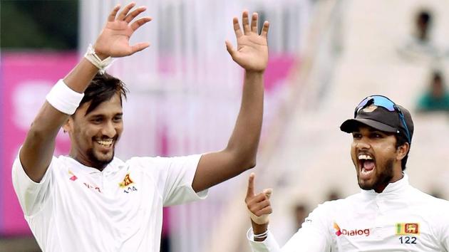 Sri Lanka cricket team’s Suranga Lakmal (left) celebrates with captain Dinesh Chandimal after dismissing Indian cricket team skipper Virat Kohli during Day 1 of the first test at Eden Gardens in Kolkata on Thursday. In a rain-hit day, Lakmal took three wickets, reducing India to 17/3 after the opening day. (PTI) Sri Lanka cricket team’s Suranga Lakmal (left) celebrates with captain Dinesh Chandimal after dismissing Indian cricket team skipper Virat Kohli during Day 1 of the first test at Eden Gardens in Kolkata on Thursday. In a rain-hit day, Lakmal took three wickets, reducing India to 17/3 after the opening day. (PTI)