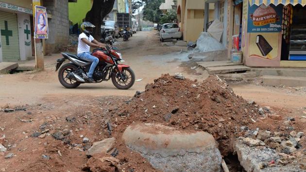 A motorist passes a road restoration project in Bangalore. (Manjunath Kiran / AFP)