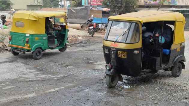 Local authorities have blamed unusually heavy monsoon rains for turning some of the city’s roads to impassable stretches of cracked bitumen. (Manjunath Kiran / AFP)