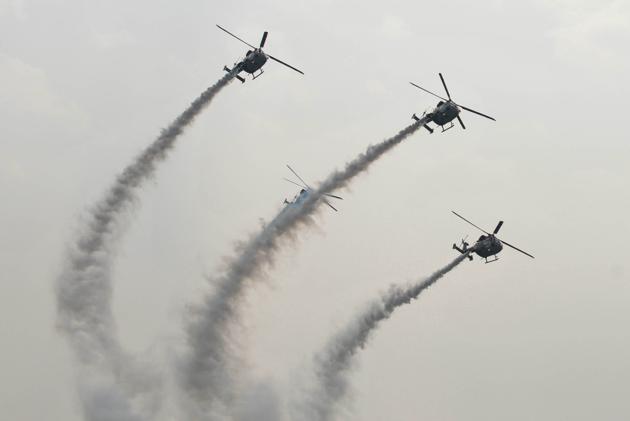 IAF helicopters displaying an air show during presentation of standards to the 117 Helicopter Unit and 223 Squadron of Indian Air Force at Adampur in Punjab on Thursday. (Pardeep Pandit/ht) 