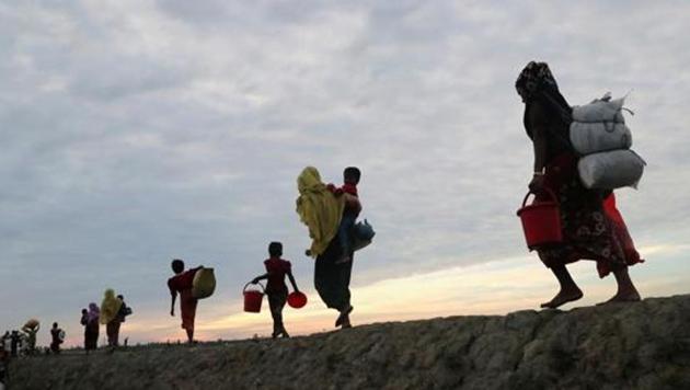 Rohingya refugees walk after crossing the Naf River with an improvised raft to reach to Bangladesh in Teknaf, Bangladesh, November 12, 2017. (REUTERS File Photo) Rohingya refugees walk after crossing the Naf River with an improvised raft to reach to Bangladesh in Teknaf, Bangladesh, November 12, 2017. (REUTERS File Photo)