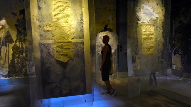 Visitors attend an art installation at the Sassoon Docks, organised by St+art Urban Art Festival in Mumbai.The street art has transformed Mumbai’s oldest fishing docks into a vibrant art space. (Anshuman Poyrekar / HT Photo)