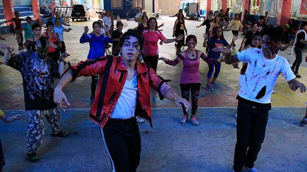 A student wears a mask as he gathers with others during a Halloween party at a school in Bangkok. (Reuters) A student wears a mask as he gathers with others during a Halloween party at a school in Bangkok. (Reuters)