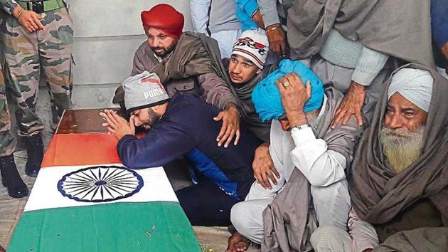 Wailing family members of Sepoy Manjinder Singh (right), 22, who was martyred fighting a fierce battle with militants in south Kashmir’s Kulgam district, at his native village Banawalion in Mansa on Thursday. (HT Photo) Wailing family members of Sepoy Manjinder Singh (right), 22, who was martyred fighting a fierce battle with militants in south Kashmir’s Kulgam district, at his native village Banawalion in Mansa on Thursday. (HT Photo)