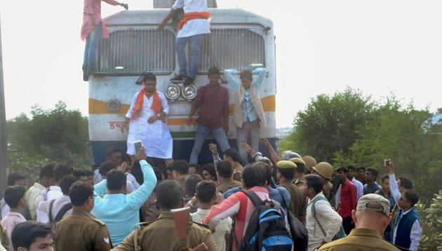 Police detain Akhil Bharatiya Kshatriya Mahasabha activists who halted the Sarnath Express train during a protest against ‘Padmavati’ in Allahabad on Thursday. The controversy took an ugly turn yesterday as a leader of the Shri Rajput Karni Sena cited Ramayana’s Surpanakha nose-chopping incident and warned Padukone against “inciting” sentiments. Reacting to the development, the Mumbai police has stepped up the actor’s security. (PTI) Police detain Akhil Bharatiya Kshatriya Mahasabha activists who halted the Sarnath Express train during a protest against ‘Padmavati’ in Allahabad on Thursday. The controversy took an ugly turn yesterday as a leader of the Shri Rajput Karni Sena cited Ramayana’s Surpanakha nose-chopping incident and warned Padukone against “inciting” sentiments. Reacting to the development, the Mumbai police has stepped up the actor’s security. (PTI)