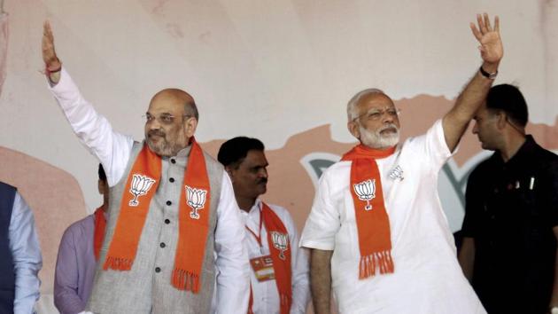 Prime Minister Narendra Modi with BJP president Amit Shah during the ‘Gujarat Gaurav Mahasammelan’ in Ahmedabad on Monday.(PTI Photo)