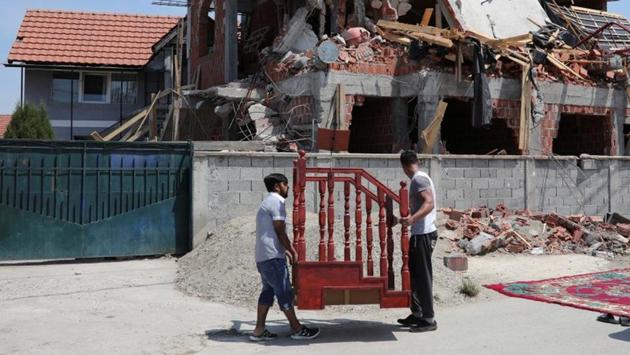 Muslims prepare to pray on a street in front of a demolished mosque in Belgrade. The Bajrakli is now Belgrade’s only official mosque. This shortage was thrown into sharp relief when authorities tore down a makeshift mosque in the northern district of Zemun Polje on the eve of Ramadan in May. (Marko Djurica / REUTERS) Muslims prepare to pray on a street in front of a demolished mosque in Belgrade. The Bajrakli is now Belgrade’s only official mosque. This shortage was thrown into sharp relief when authorities tore down a makeshift mosque in the northern district of Zemun Polje on the eve of Ramadan in May. (Marko Djurica / REUTERS)