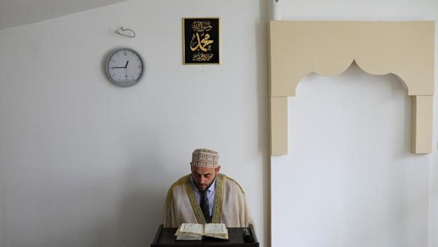 An Imam reads the Quran in a makeshift mosque during Friday prayers. The Islamic community says local authorities have repeatedly ignored requests for new mosques to be built. The shortage raises questions about the country’s commitment to minority rights, an important gauge of its readiness for membership of the European Union. (Marko Djurica / REUTERS) An Imam reads the Quran in a makeshift mosque during Friday prayers. The Islamic community says local authorities have repeatedly ignored requests for new mosques to be built. The shortage raises questions about the country’s commitment to minority rights, an important gauge of its readiness for membership of the European Union. (Marko Djurica / REUTERS)