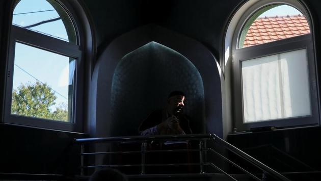 An Imam delivers a speech during inside a makeshift mosque in Belgrade. Despite the odds, the community is determined to continue practising their religion, regardless of the obstacles. Emin Zejnulahu, mufti of the demolished mosque in Zemun Polje, said Muslims would not be deterred. (Marko Djurica / REUTERS) An Imam delivers a speech during inside a makeshift mosque in Belgrade. Despite the odds, the community is determined to continue practising their religion, regardless of the obstacles. Emin Zejnulahu, mufti of the demolished mosque in Zemun Polje, said Muslims would not be deterred. (Marko Djurica / REUTERS)